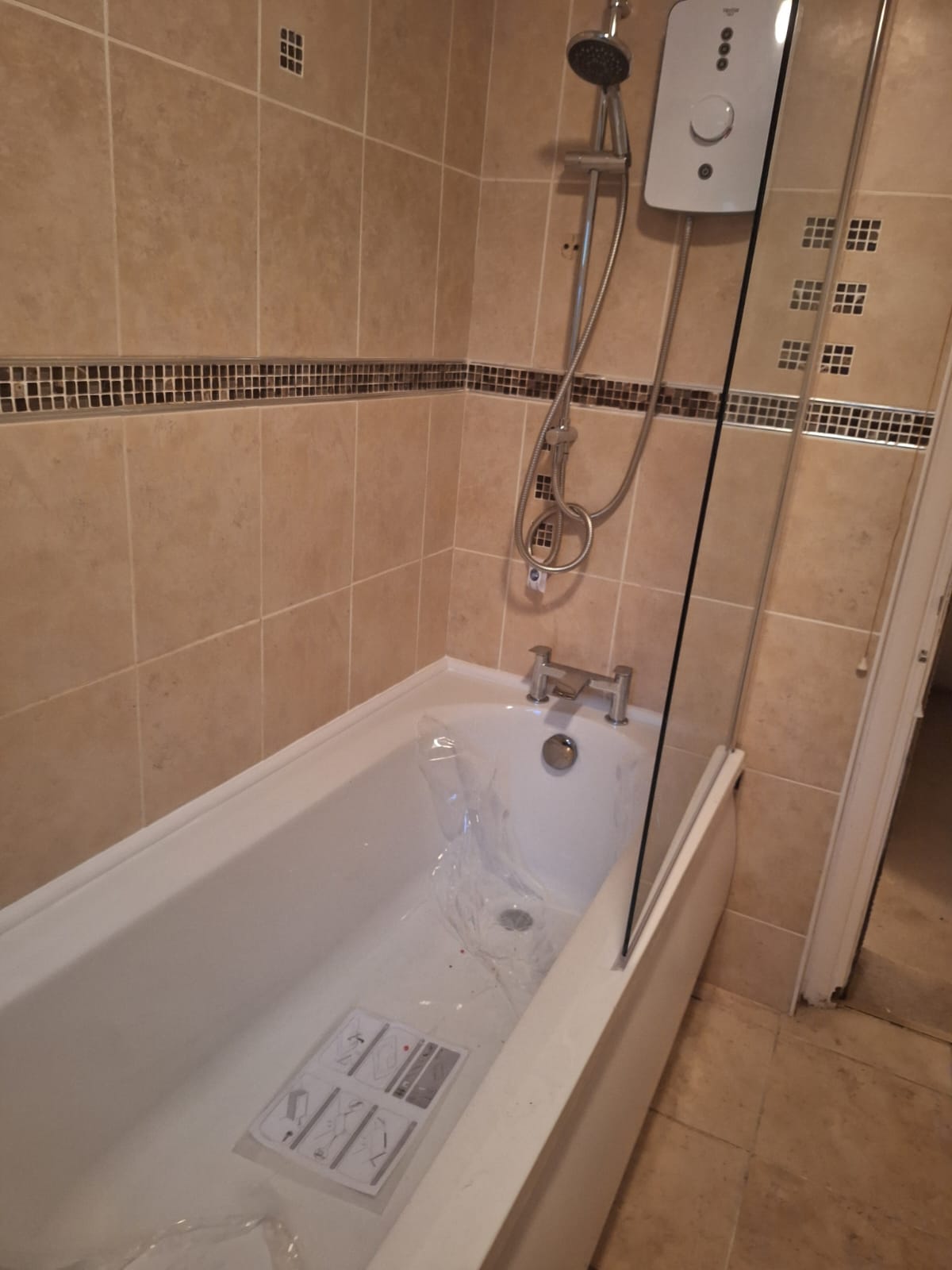 Beige tiled bathroom before renovation