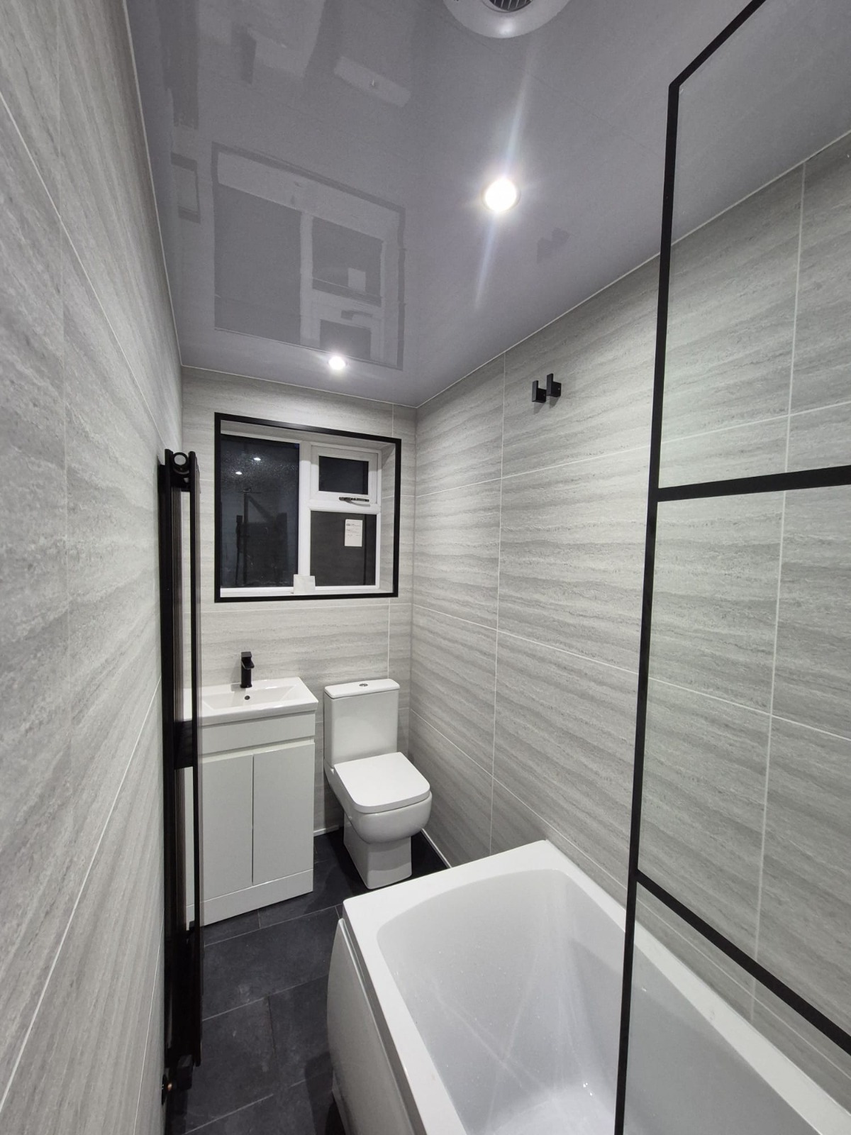 Contemporary bathroom with black framed window